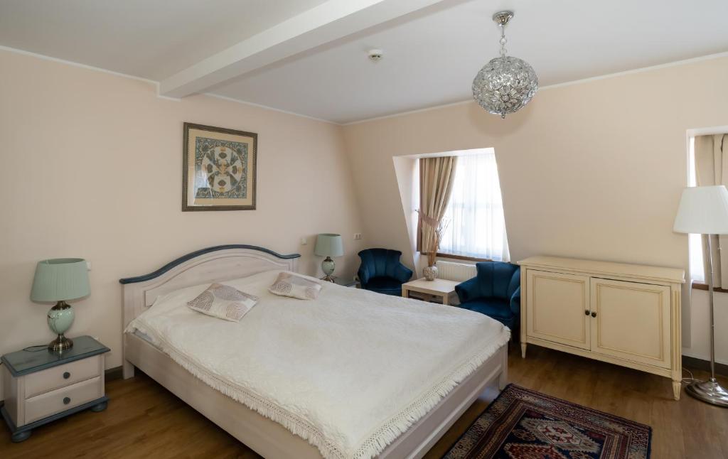 Postel nebo postele na pokoji v ubytování St. Peter's Boutique Hotel