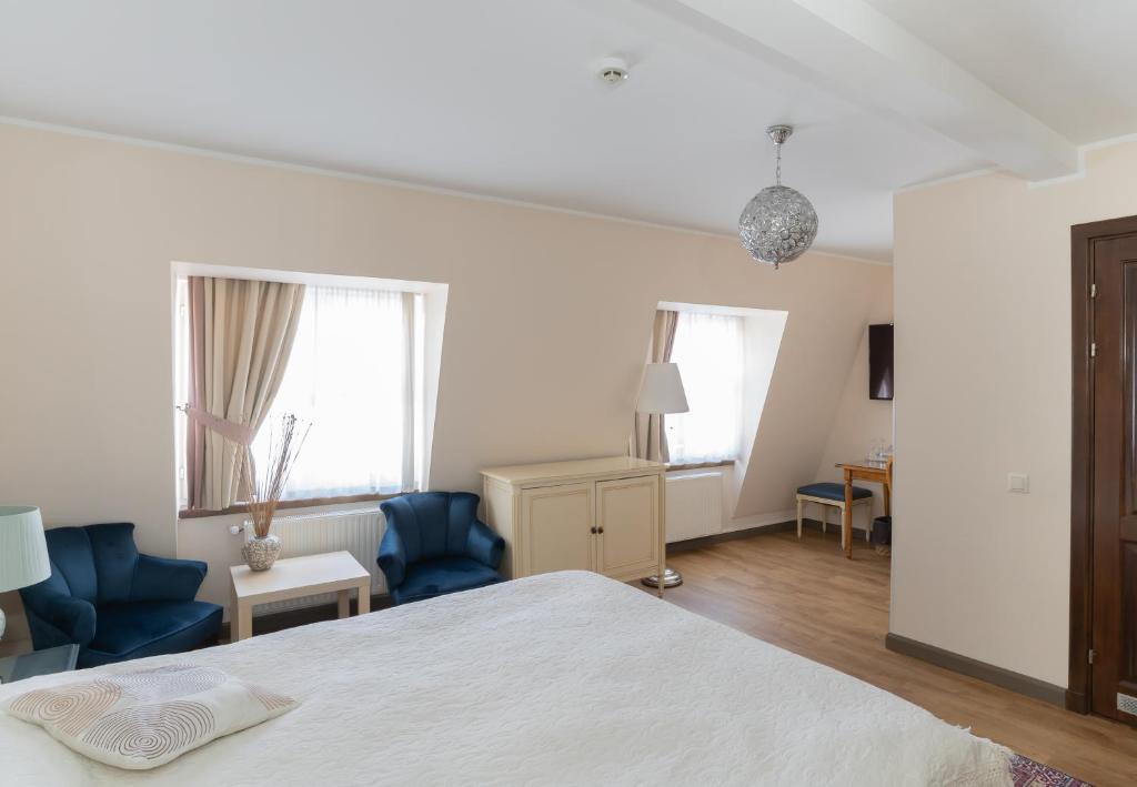 Postel nebo postele na pokoji v ubytování St. Peter's Boutique Hotel