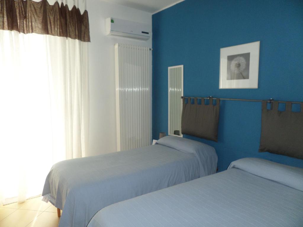 Postel nebo postele na pokoji v ubytování B&B Palatium S.G.