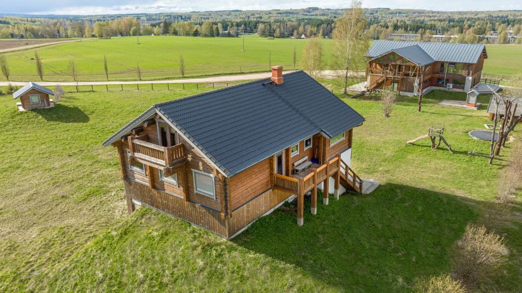 an overhead view of a log cabin in a field at Kotkapesa 