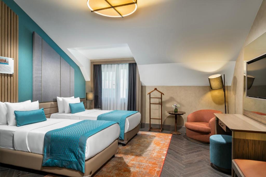 Postel nebo postele na pokoji v ubytování Aspera Hotel Altunizade