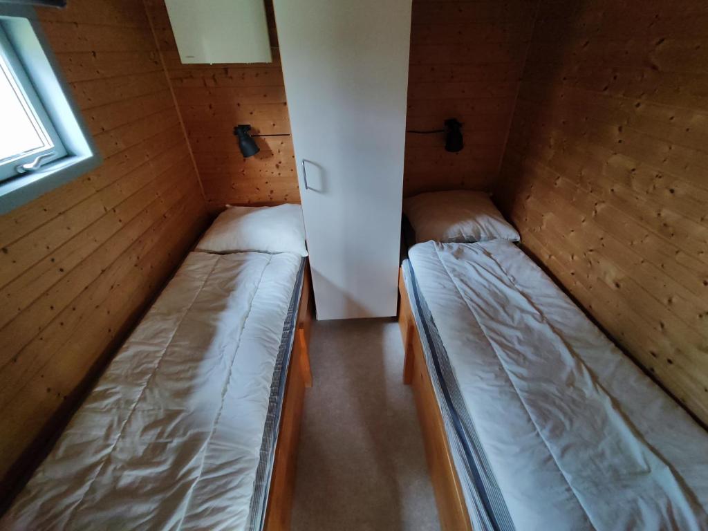 Postel nebo postele na pokoji v ubytování Tranum Klit Camping og Hytteudlejning