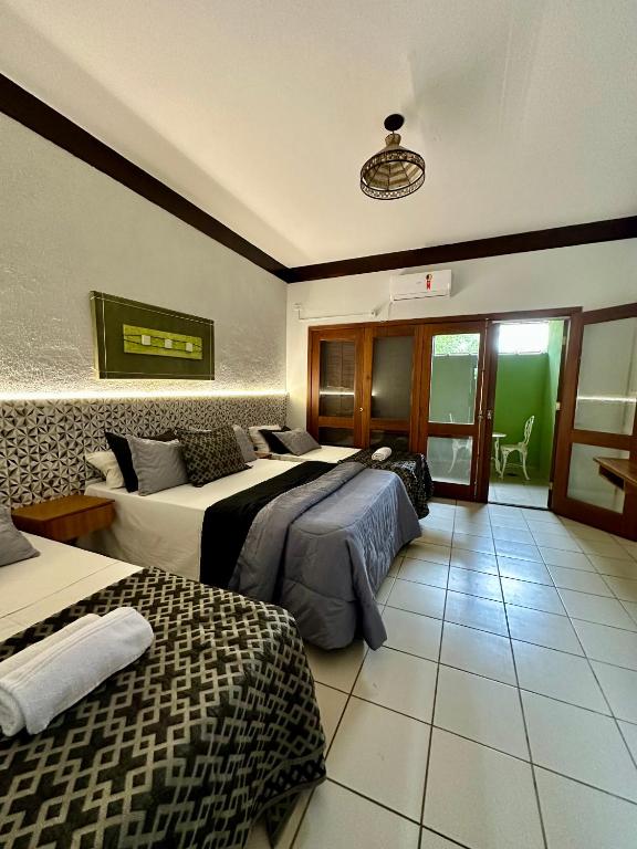 Cama ou camas em um quarto em Recanto Verde Praia Hotel Juquehy