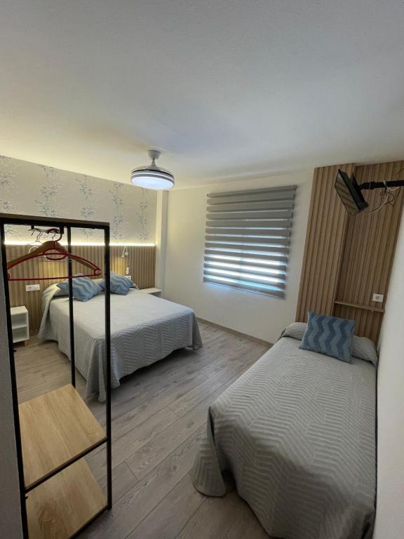 Posteľ alebo postele v izbe v ubytovaní Hostal Calderón de la Barca