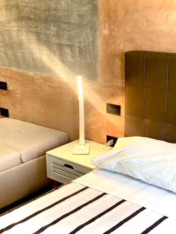 Postel nebo postele na pokoji v ubytování HOTEL TECH