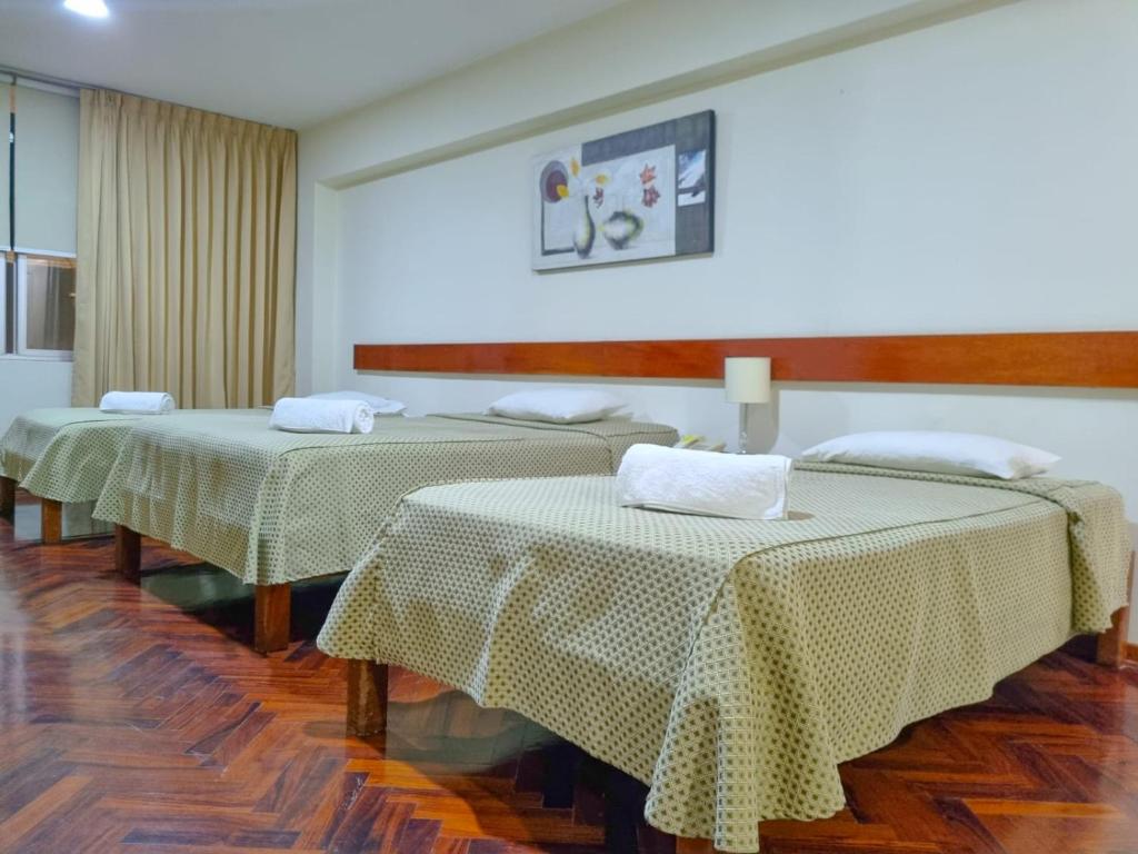 Postel nebo postele na pokoji v ubytování Hostal Solari