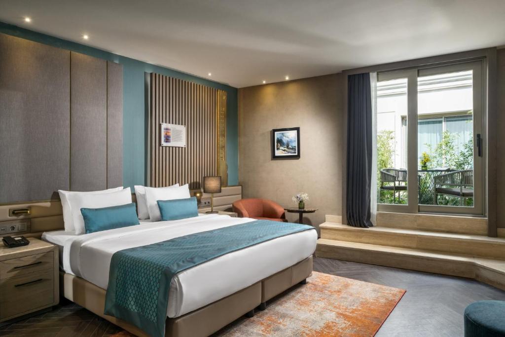 Postel nebo postele na pokoji v ubytování Aspera Hotel Altunizade