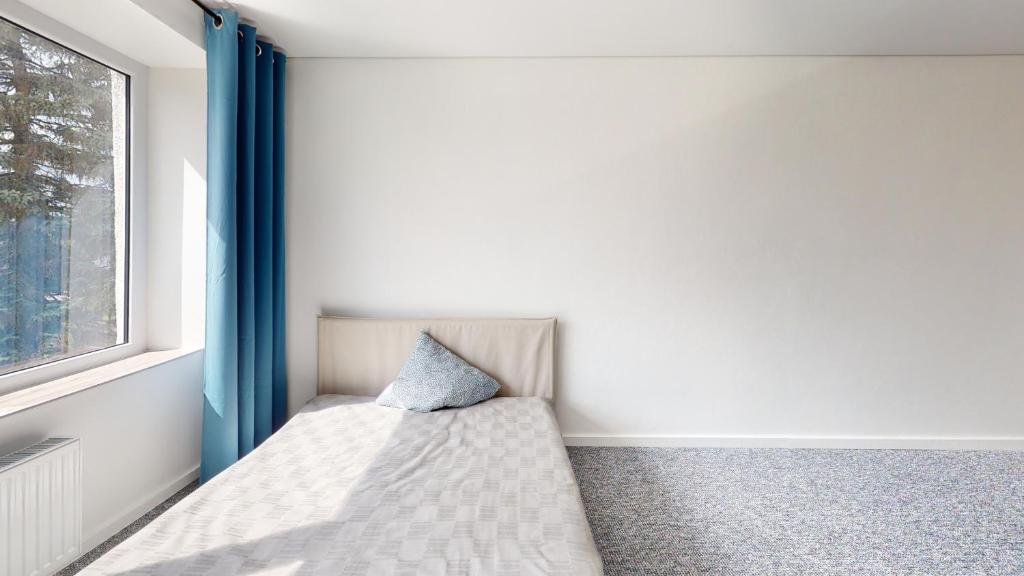 Postel nebo postele na pokoji v ubytování Kivi Apartments