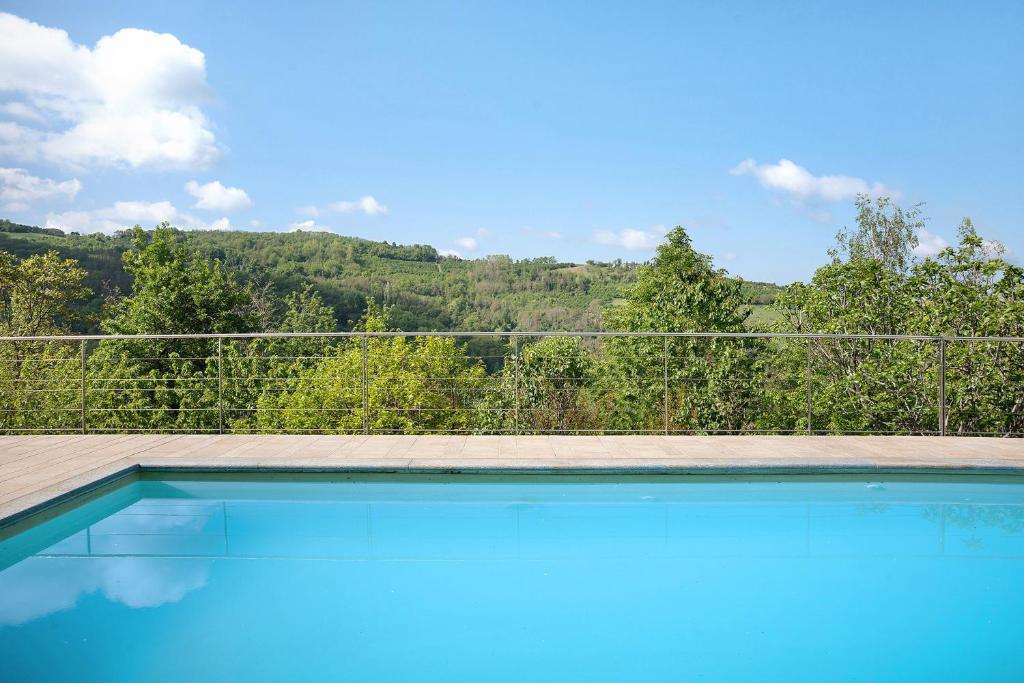 a swimming pool with a view of a mountain at La Corte di Langa alloggio Rubino in Albaretto Della Torre 