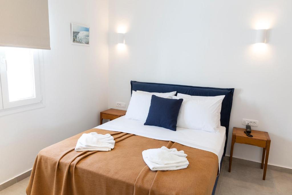 Llit o llits en una habitació de Asimina Hotel