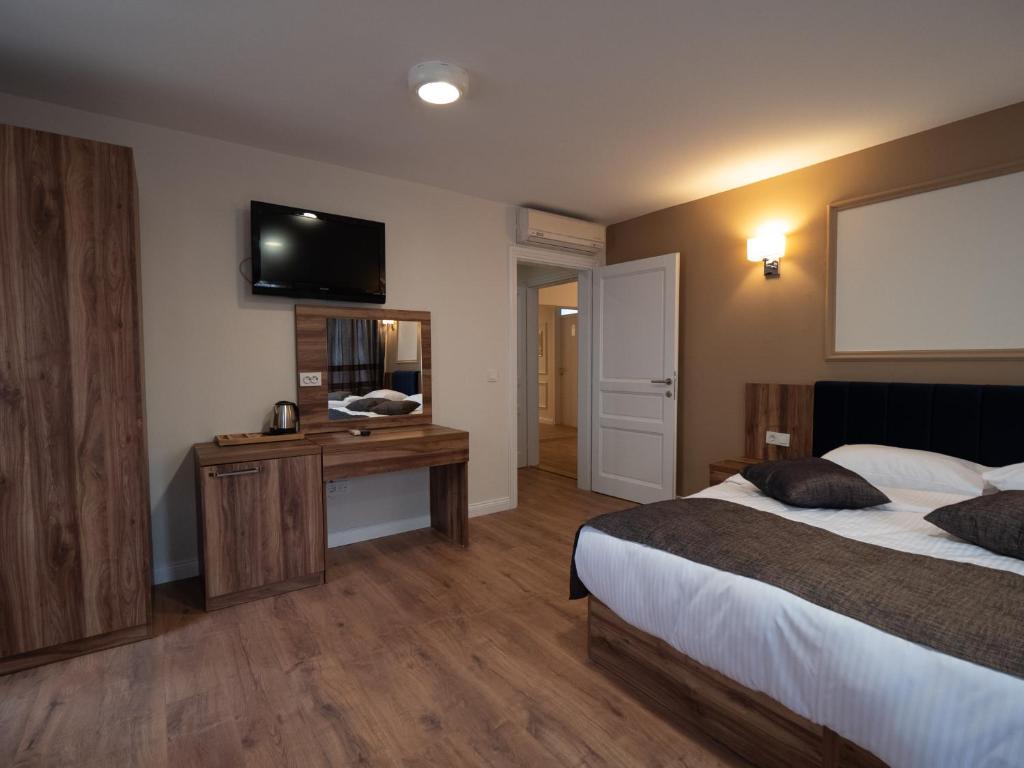 Postel nebo postele na pokoji v ubytování Amber Hotel