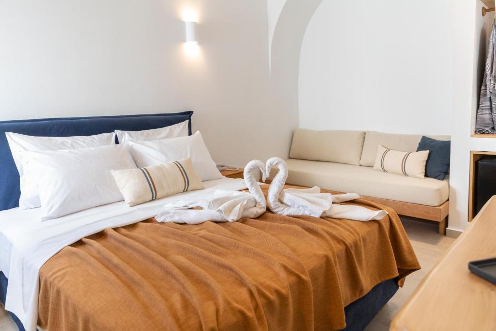 Llit o llits en una habitació de Asimina Hotel