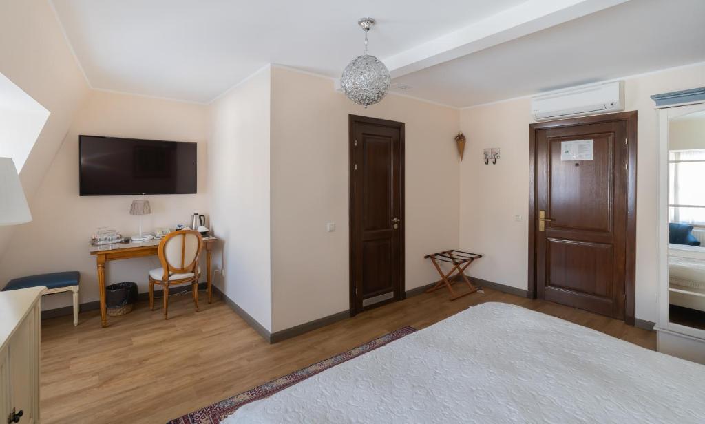 Postel nebo postele na pokoji v ubytování St. Peter's Boutique Hotel