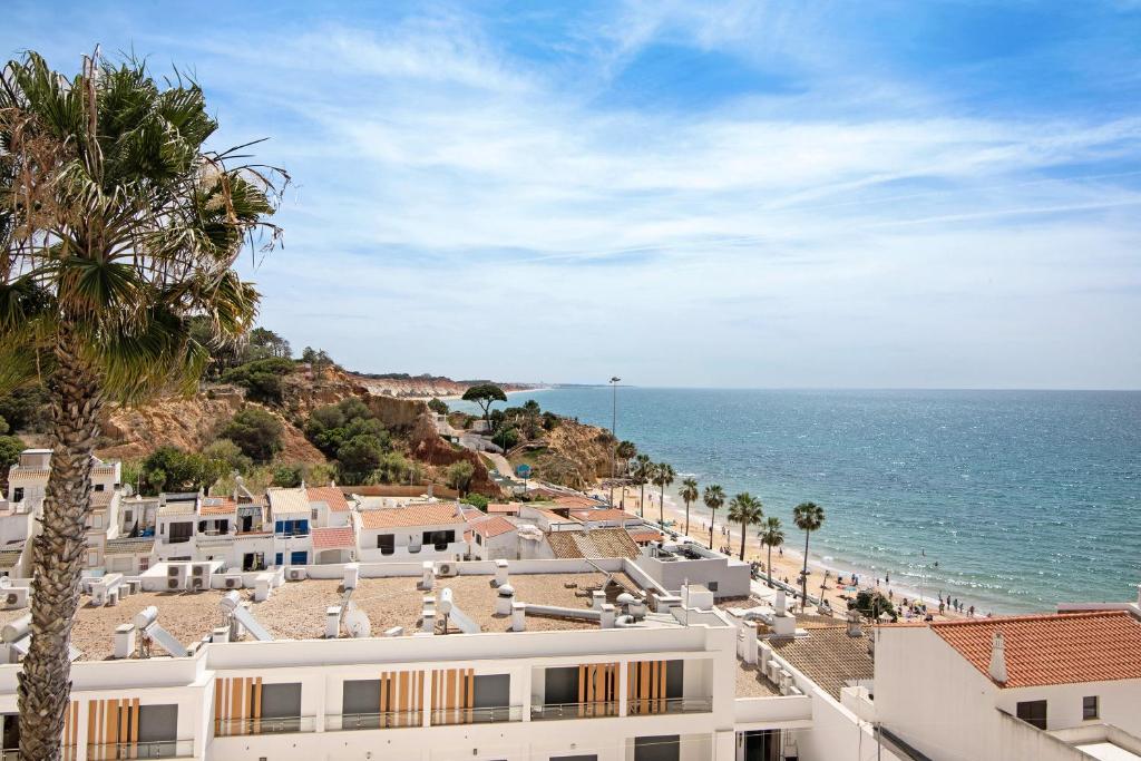 a view of the ocean from a resort at T3 Duplex Albufeira in Olhos de Água