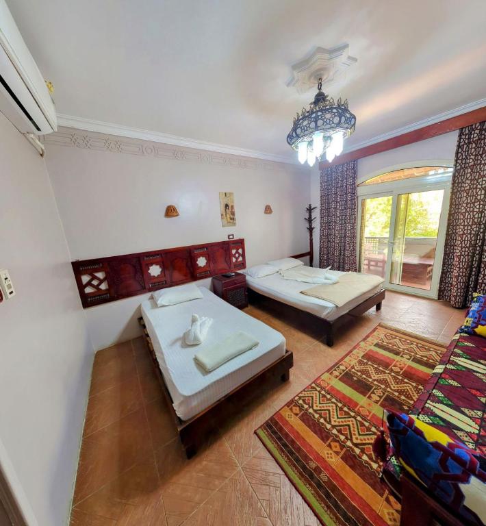 Postel nebo postele na pokoji v ubytování Ali Baba Hotel
