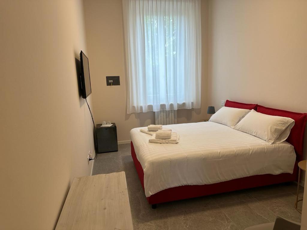 Postel nebo postele na pokoji v ubytování Hotel Il Duca barbablu
