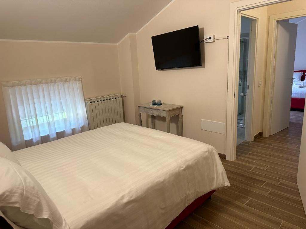 Postel nebo postele na pokoji v ubytování Hotel Il Duca barbablu