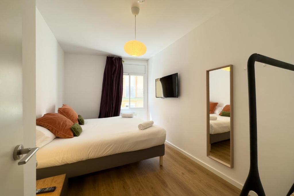 Postel nebo postele na pokoji v ubytování AinB Barcelona Sants Apartments