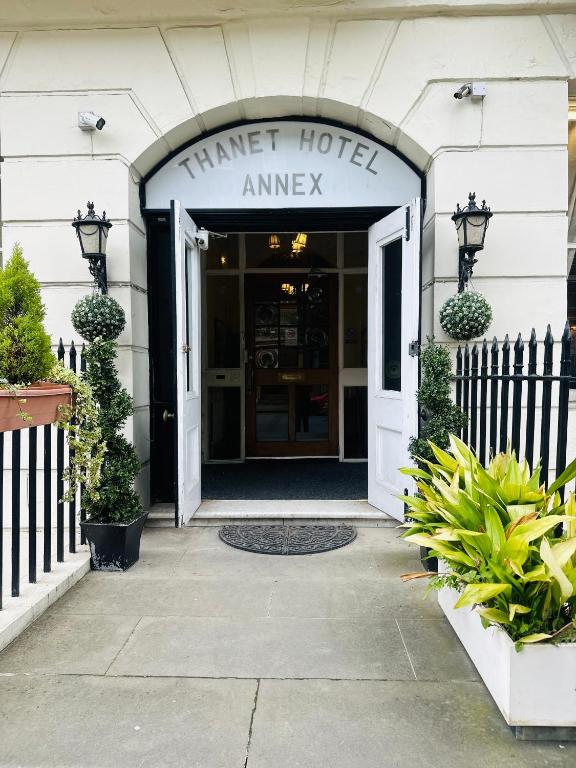 an entrance to a hotel with a sign that reads timer hotel amway at Thanet Hotel Annex in London