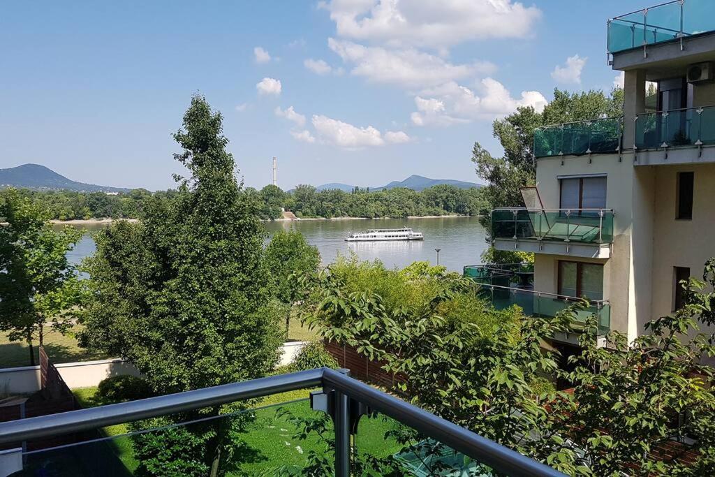 a view of a river from a balcony of a building at Danube Dream Superb view & garage in Budapest