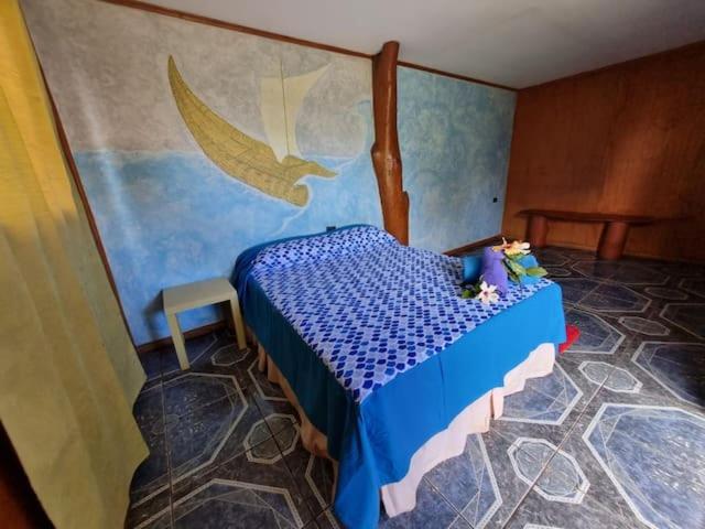 Postel nebo postele na pokoji v ubytování marari rapa nui