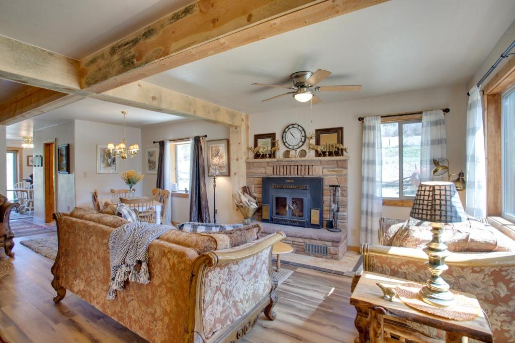 a living room with couches and a fireplace at Cozy Dolores Getaway Hike, Fish and More! in Dolores