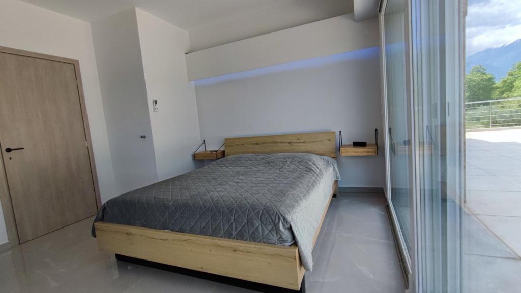 Postel nebo postele na pokoji v ubytování Anesi Suites & Rooms