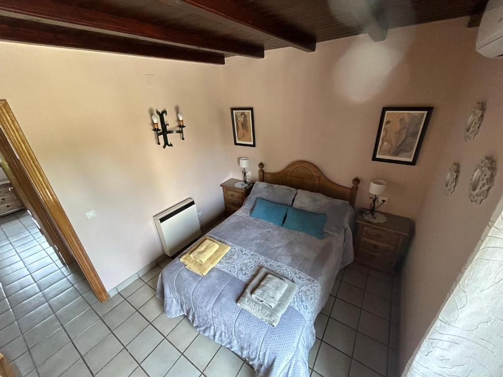 Postel nebo postele na pokoji v ubytování Casa Rincón de Claudia
