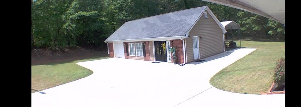 an overhead view of a small house with a garage at A Peaceful Hidden Treasure in Oxford GA in Conyers