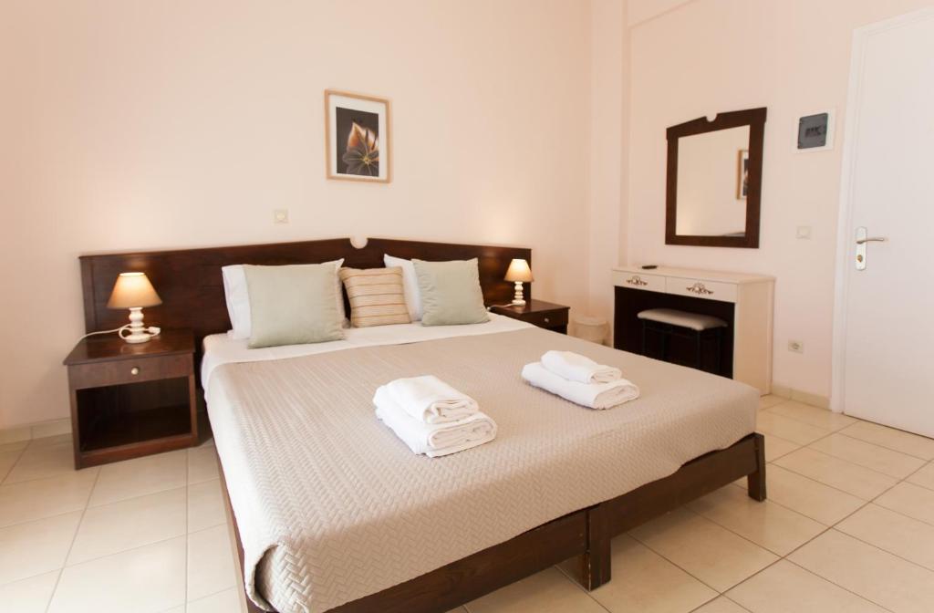 Postel nebo postele na pokoji v ubytování Hotel Thetis