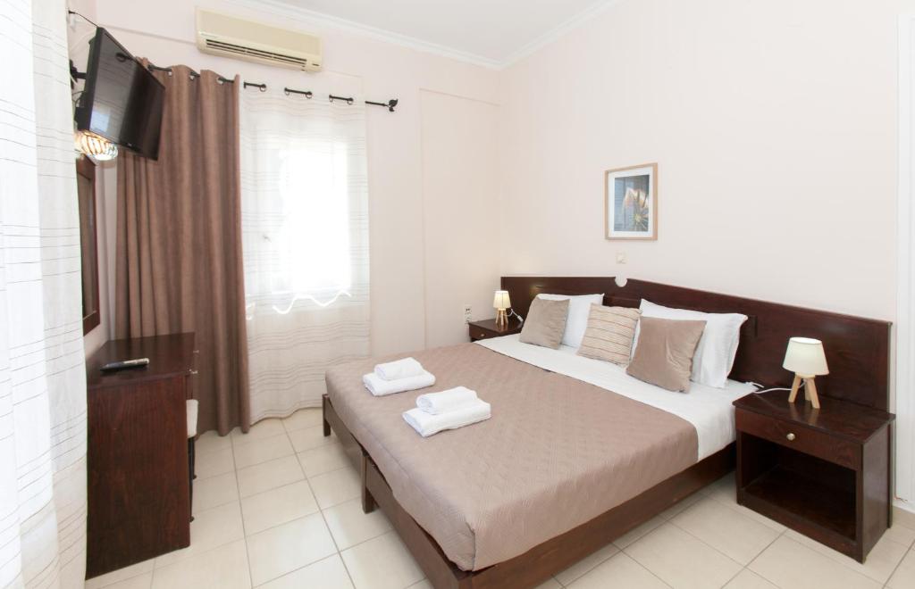 Postel nebo postele na pokoji v ubytování Hotel Thetis