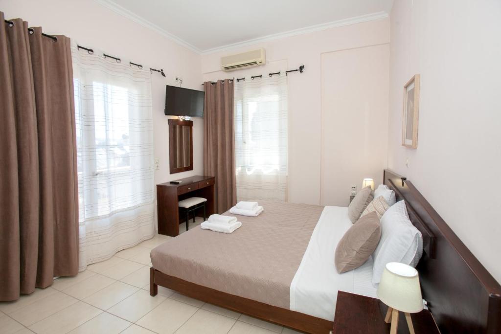 Postel nebo postele na pokoji v ubytování Hotel Thetis