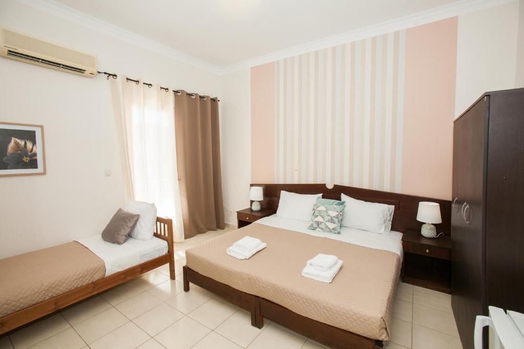 Postel nebo postele na pokoji v ubytování Hotel Thetis