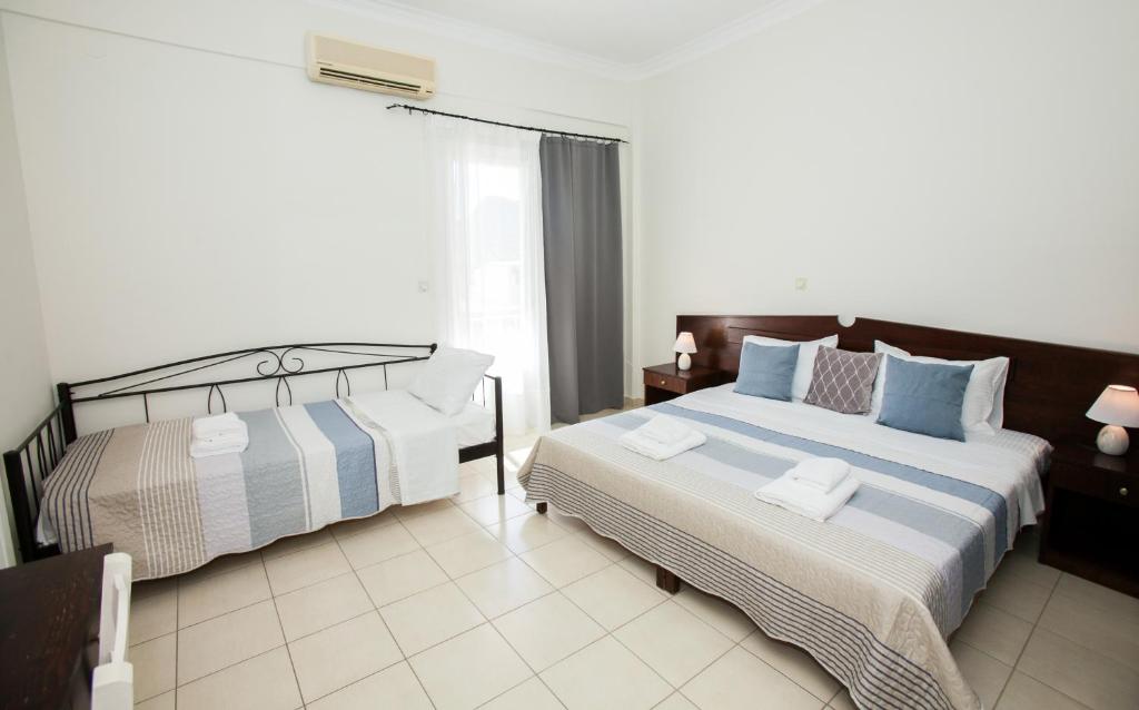 Postel nebo postele na pokoji v ubytování Hotel Thetis