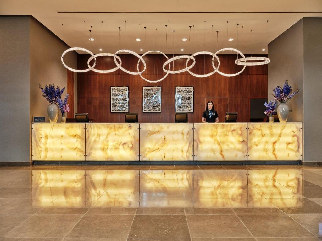 a man standing in front of a hotel lobby at InterContinental Warszawa, an IHG Hotel in Warsaw