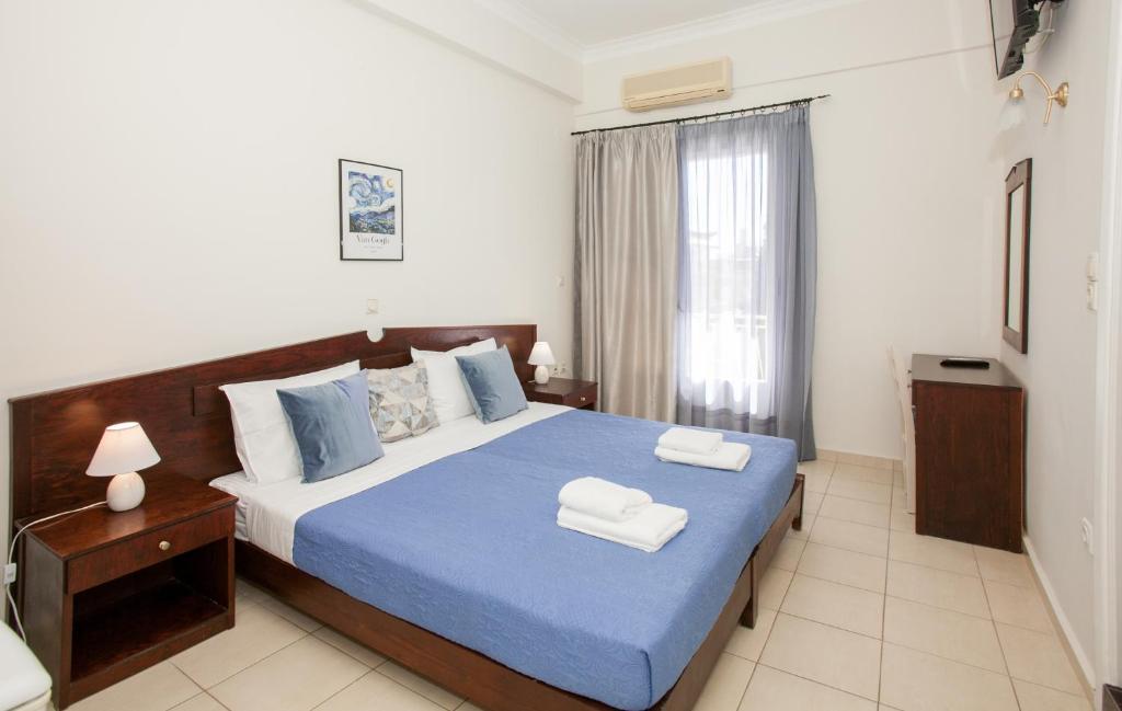 Postel nebo postele na pokoji v ubytování Hotel Thetis