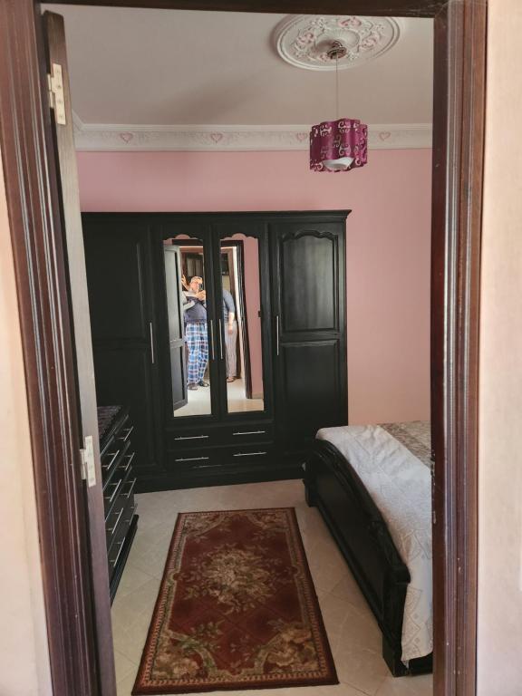 Een bed of bedden in een kamer bij Tanger méditerranée