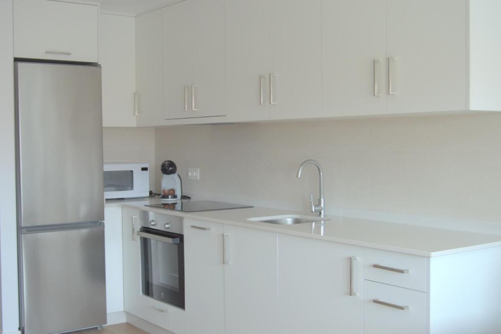 Kuchyň nebo kuchyňský kout v ubytování Apartamentos Son do Faro Fisterra