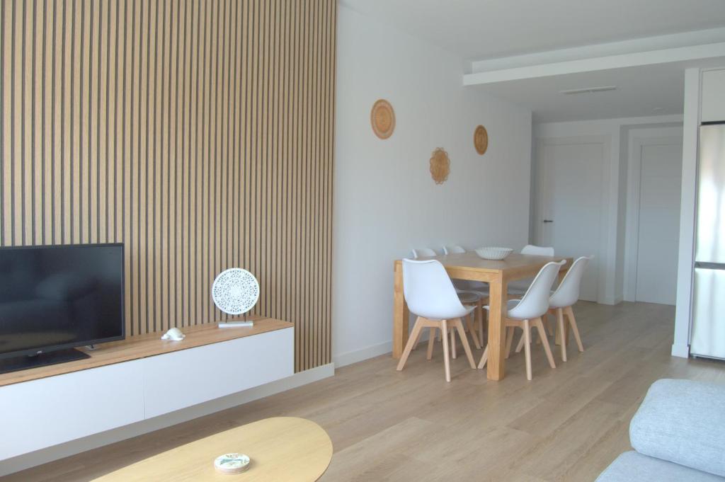 TV a/nebo společenská místnost v ubytování Apartamentos Son do Faro Fisterra