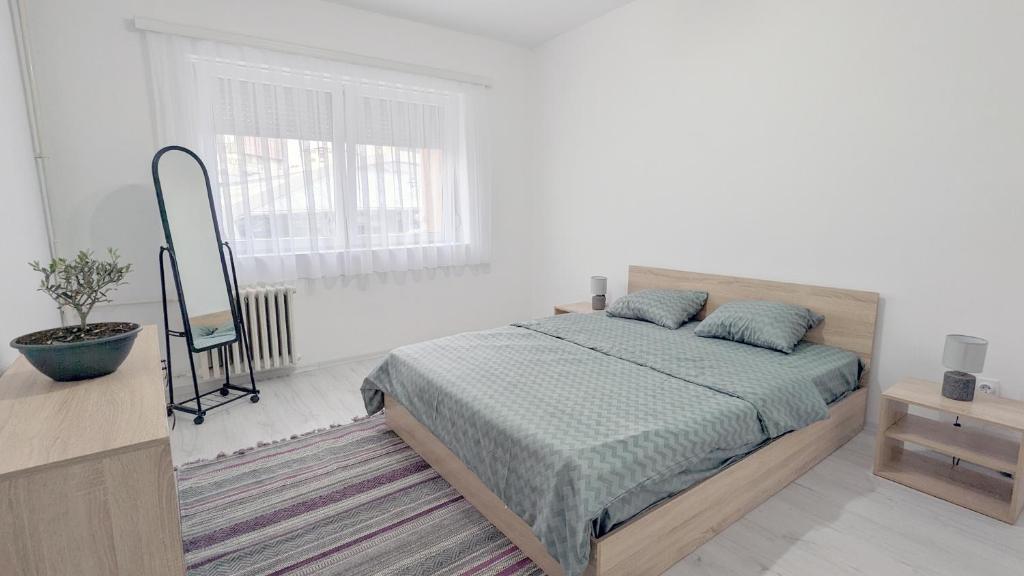 Säng eller sängar i ett rum på Main Square Apartment - Skopje