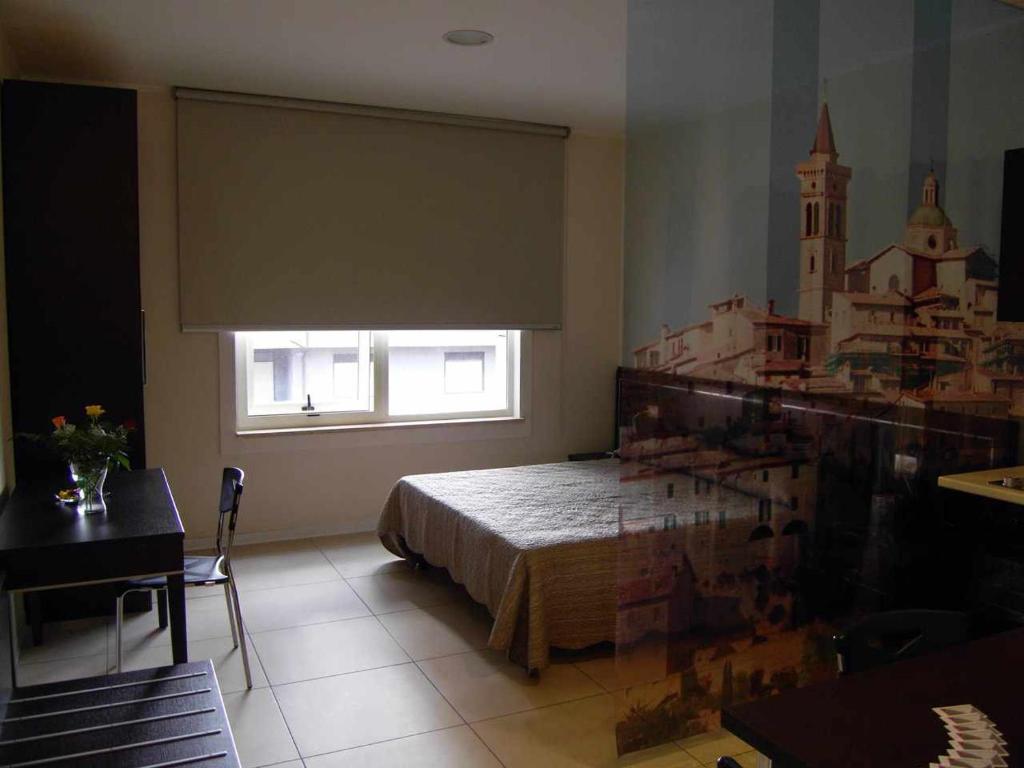 Łóżko lub łóżka w pokoju w obiekcie Ospitaci Casa Vacanze Trevi