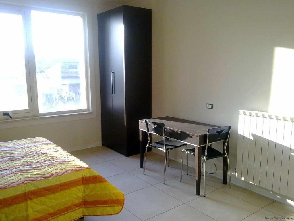 Łóżko lub łóżka w pokoju w obiekcie Ospitaci Casa Vacanze Trevi