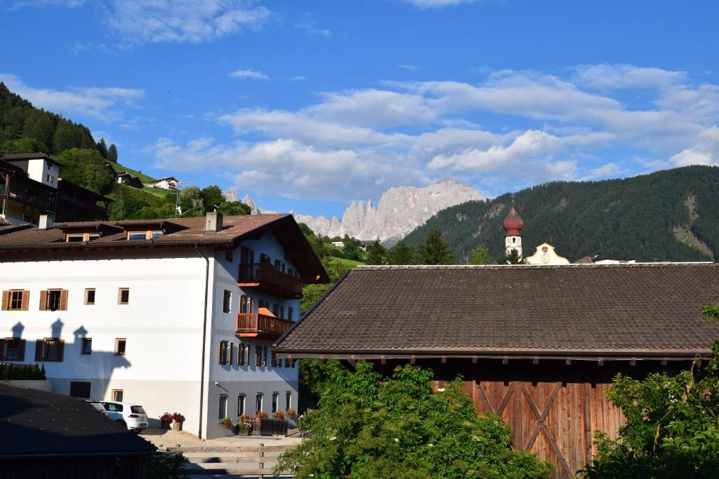 a view of a town with mountains in the background at Messner Hof in Tires