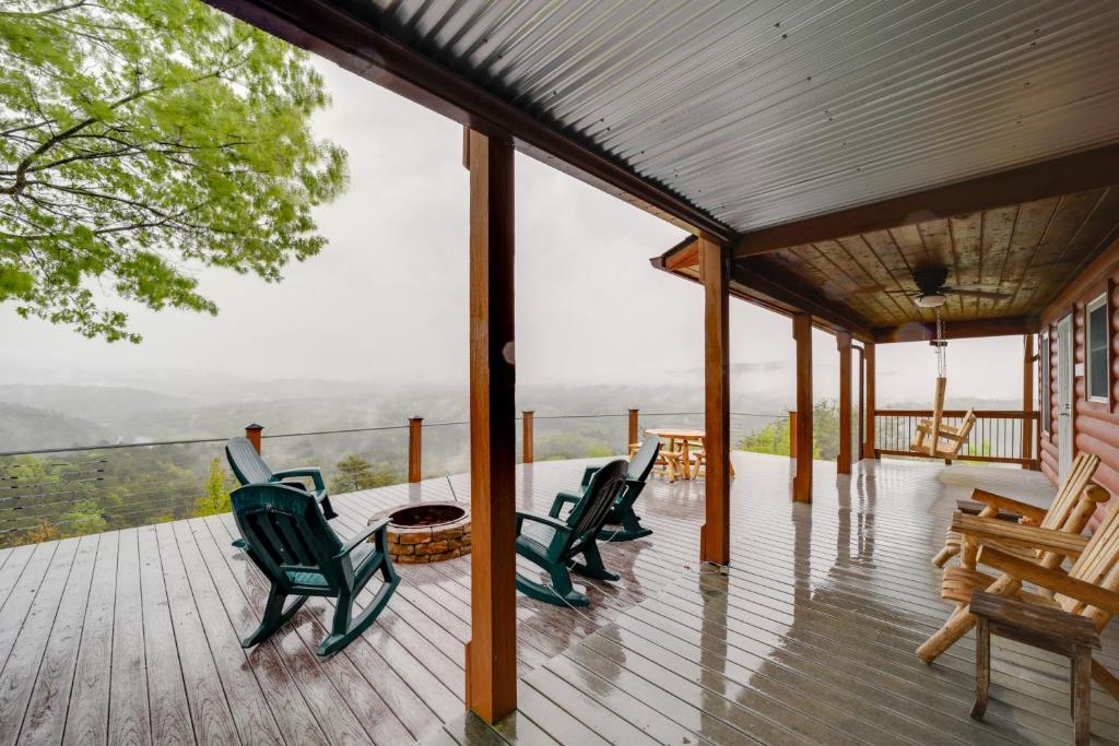 a porch with chairs and a table and a view at Blue Ridge Mountain Cabin with Views, 2 Mi to Dtwn! in Murphy
