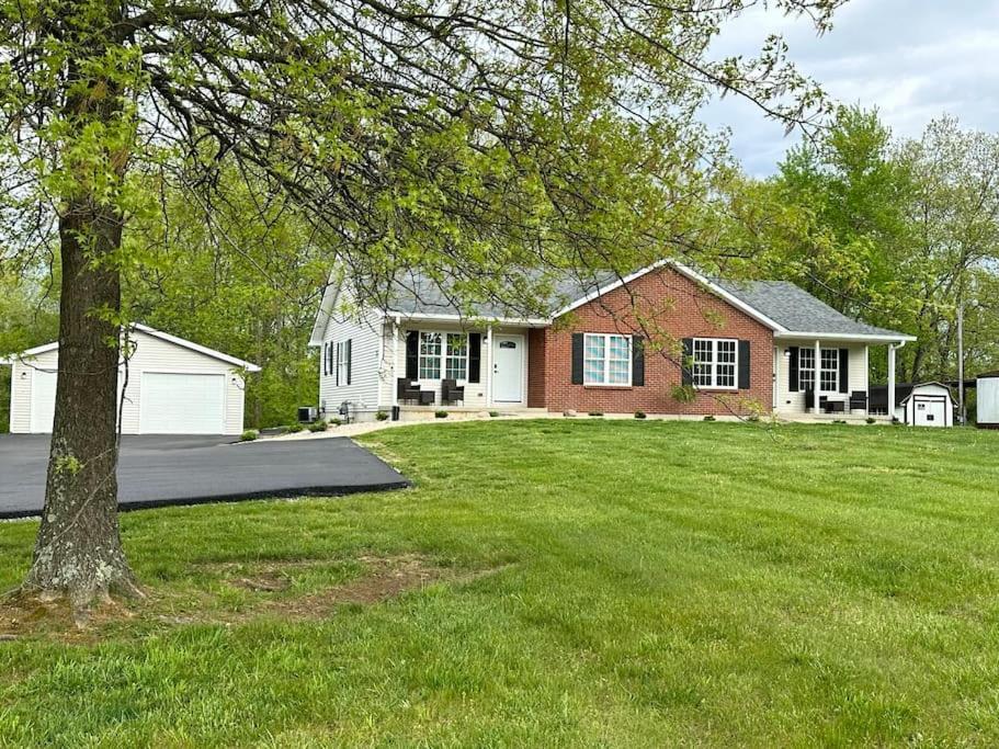 a house with a green lawn in front of it at Suite 2 