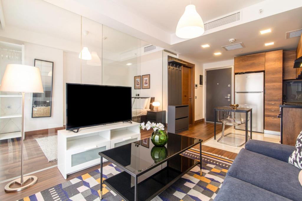 a living room with a large flat screen tv at Stylish Flat with Central Location in Sisli in Istanbul