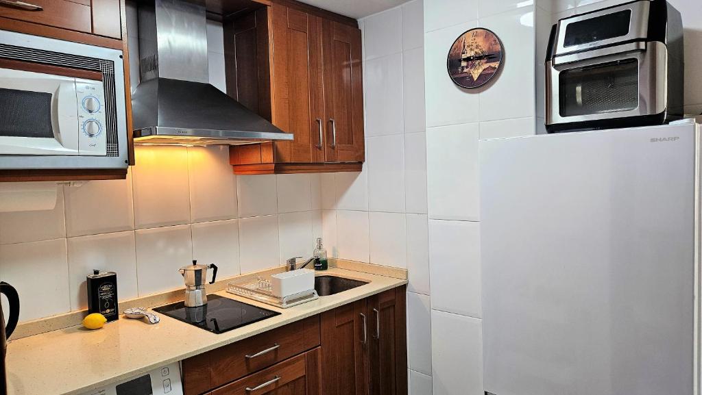 Kuchyň nebo kuchyňský kout v ubytování Sunny Stay Apartamento