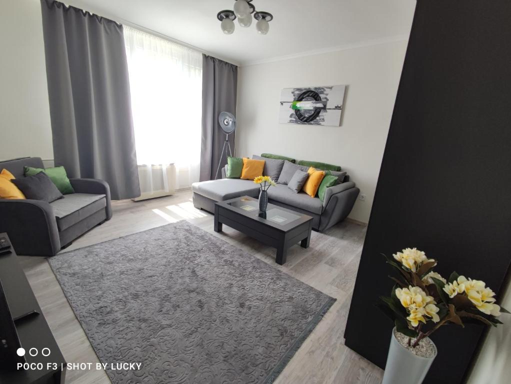 Posezení v ubytování Central Greatforest Apartman