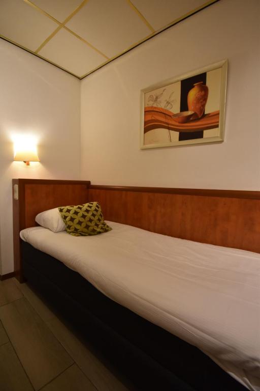 Postel nebo postele na pokoji v ubytování ITC Hotel