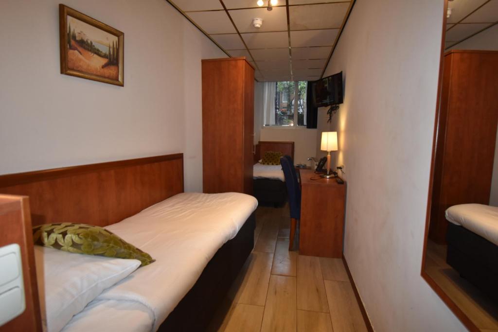 Postel nebo postele na pokoji v ubytování ITC Hotel